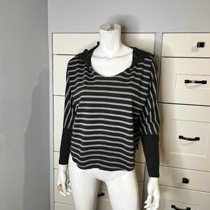 Seductions. Size medium. Cropped hoodie. Black and gray striped.